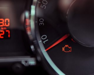 Check engine light. Car dashboard in closeup